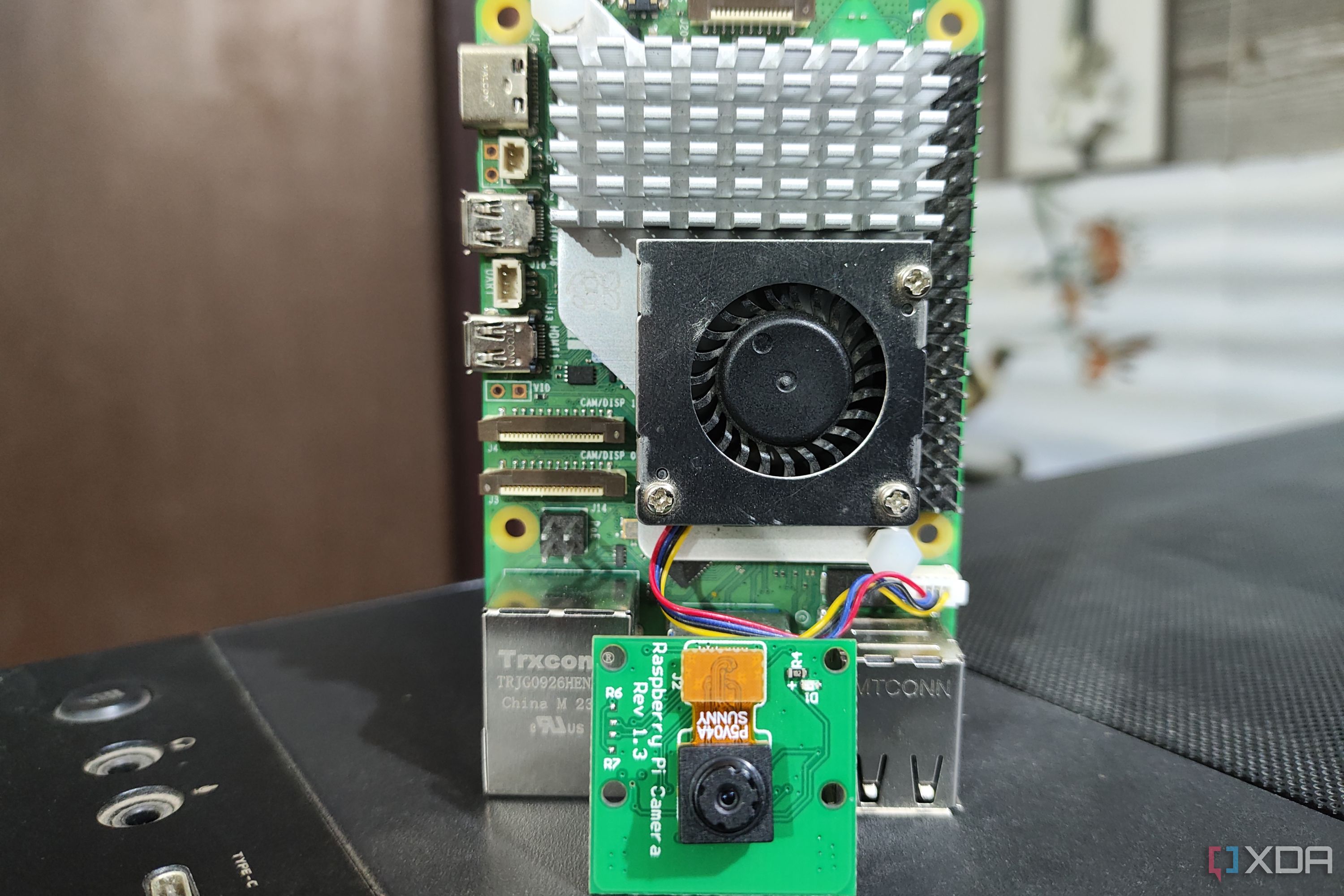A Raspberry Pi 5 kept next to a camera module