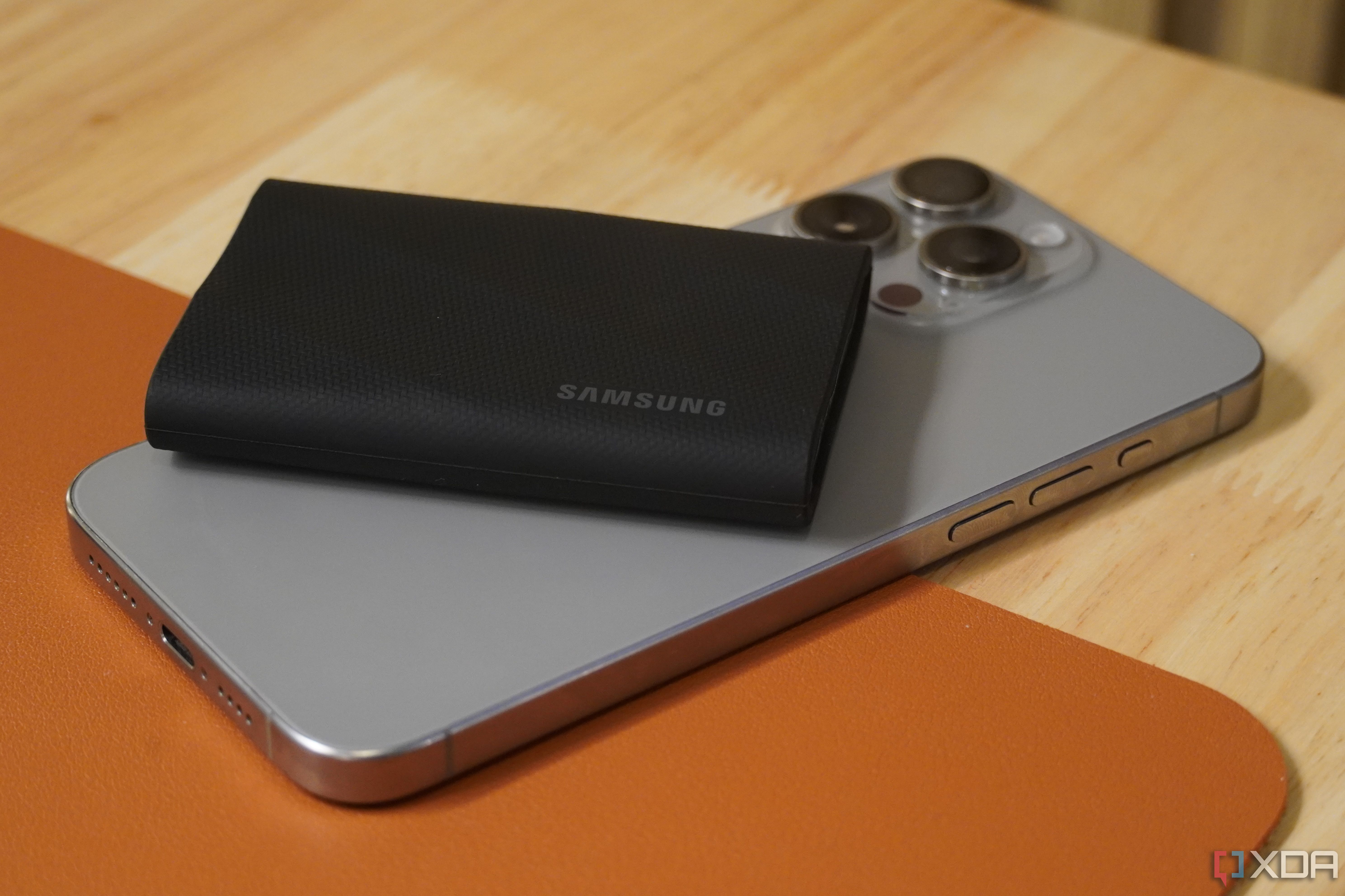 A Samsung T9 Portable SSD on an iPhone 15 Pro Max.