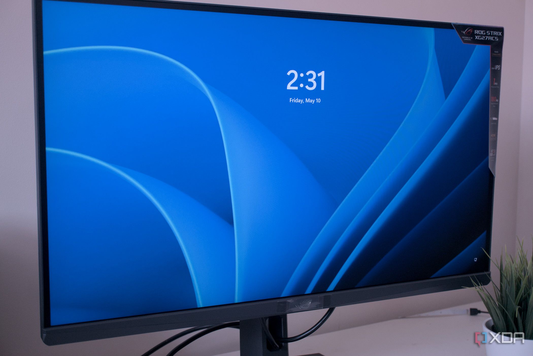 Side view of the Asus ROG Strix XG27ACS Windows login screen