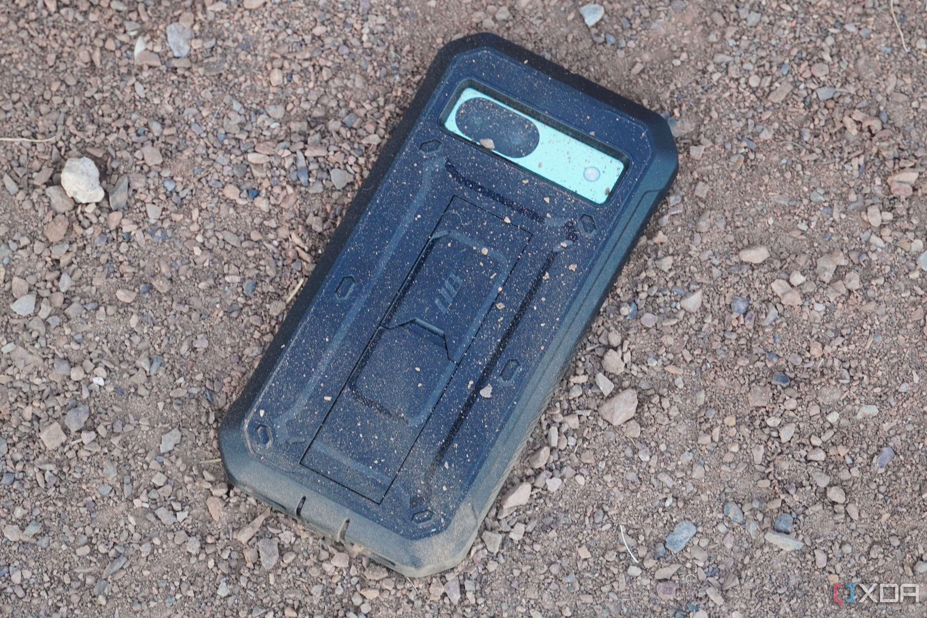 Supcase UBP case with scattered dirt and stones.