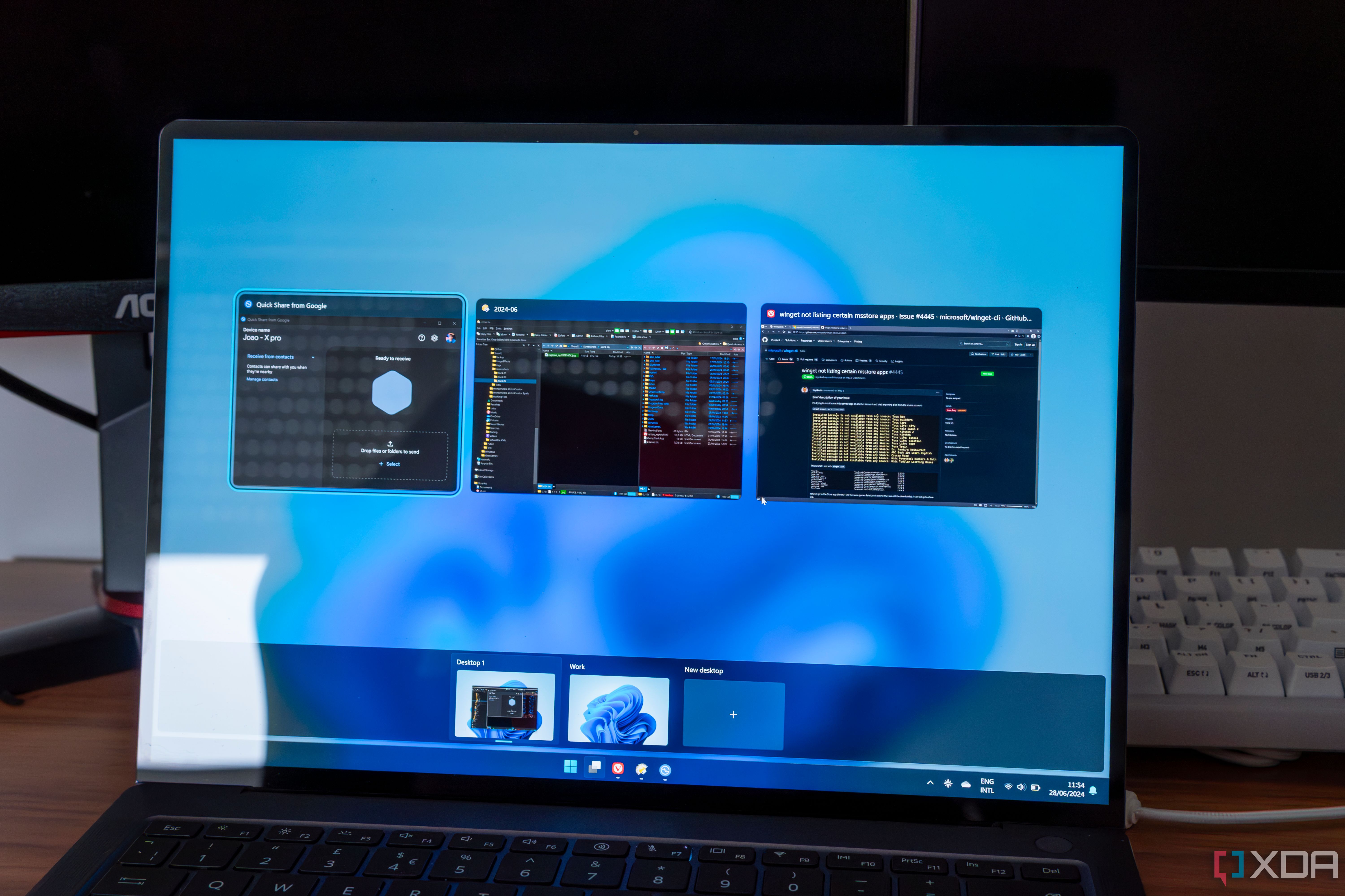 A Windows 11 laptop showing the Task View screen with two desktops at the bottom