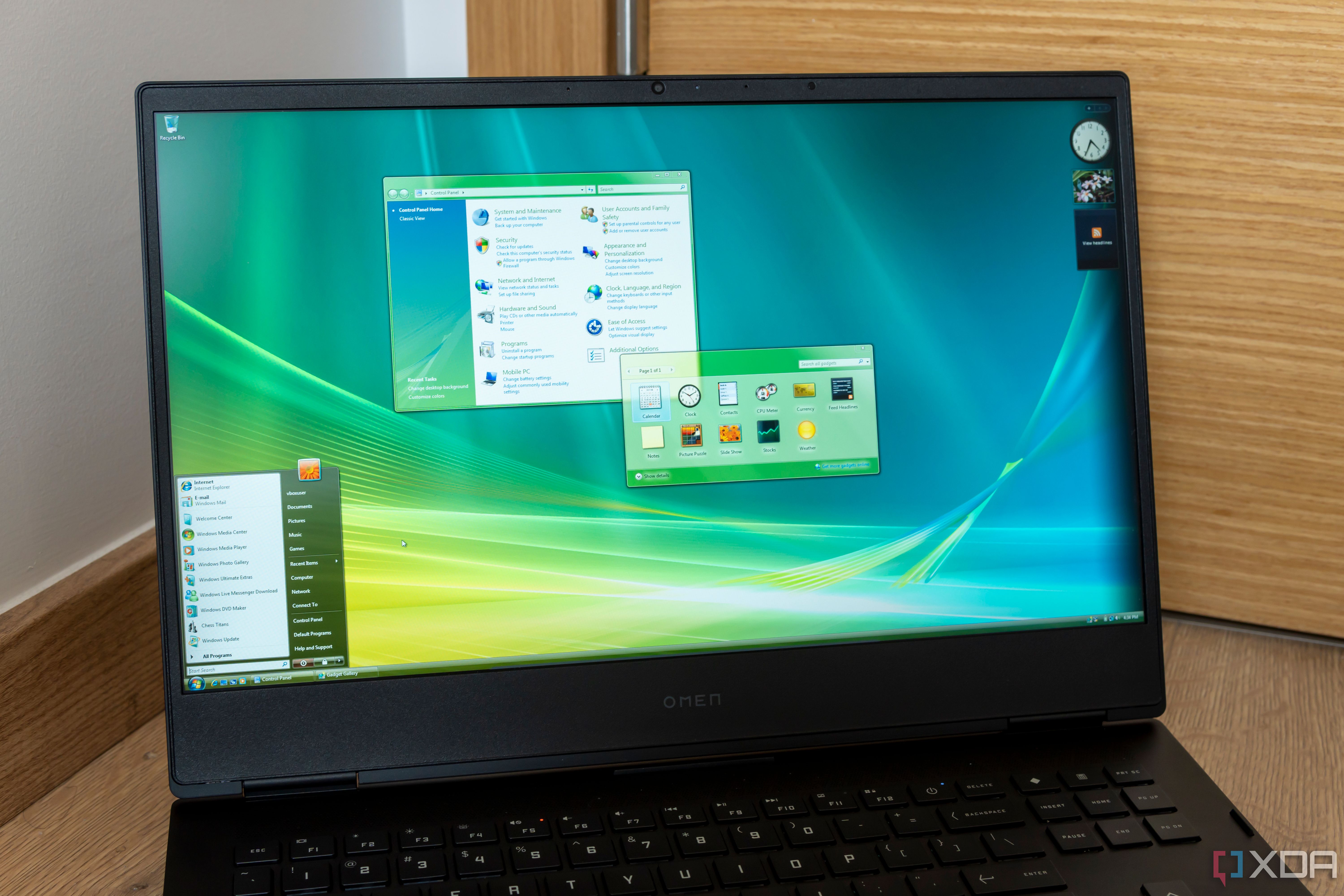 A laptop running Windows Vista with multiple windows open