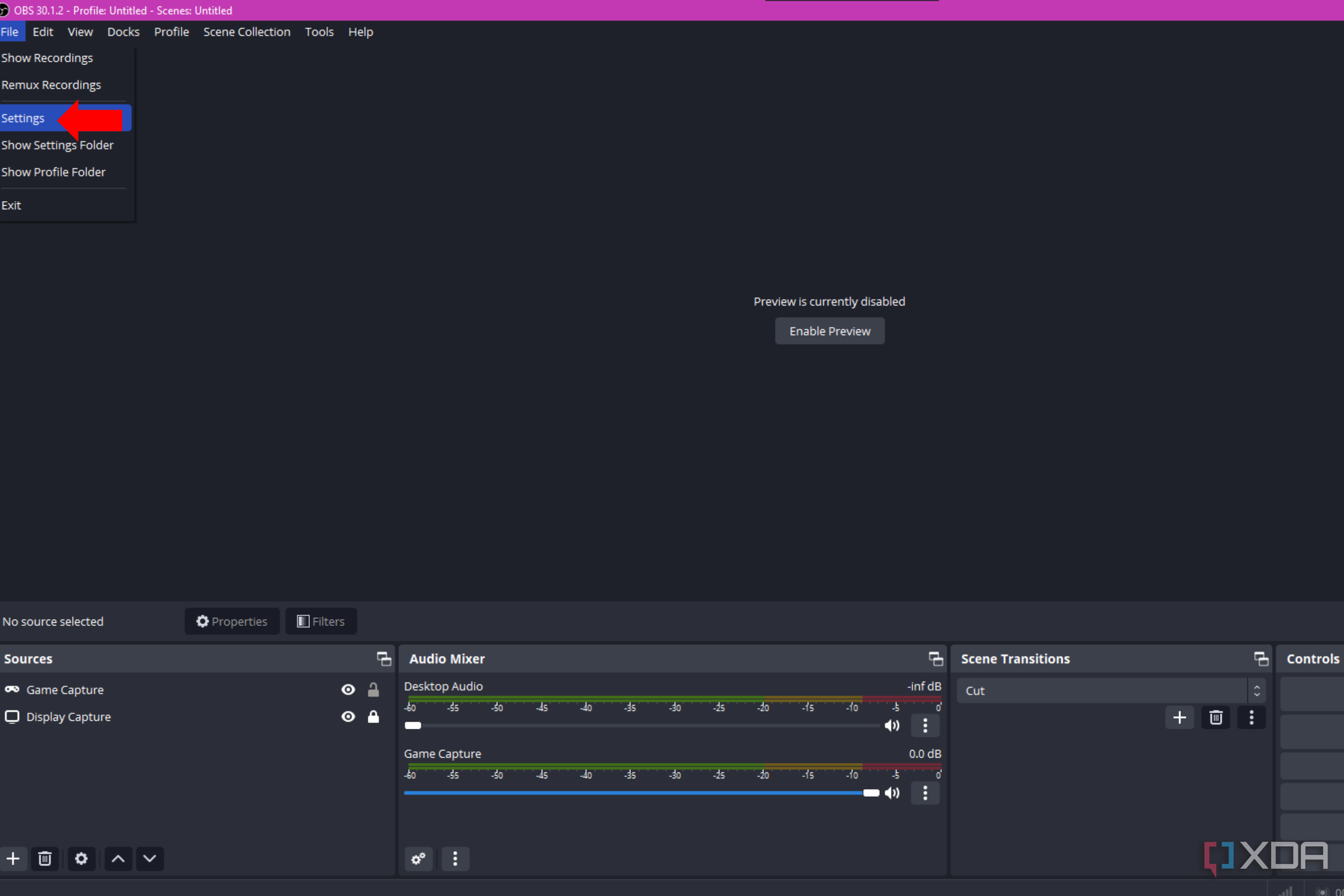 An arrow pointing to the settings option in OBS Studio