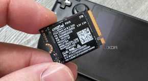 crucial p310 ssd held in fingers