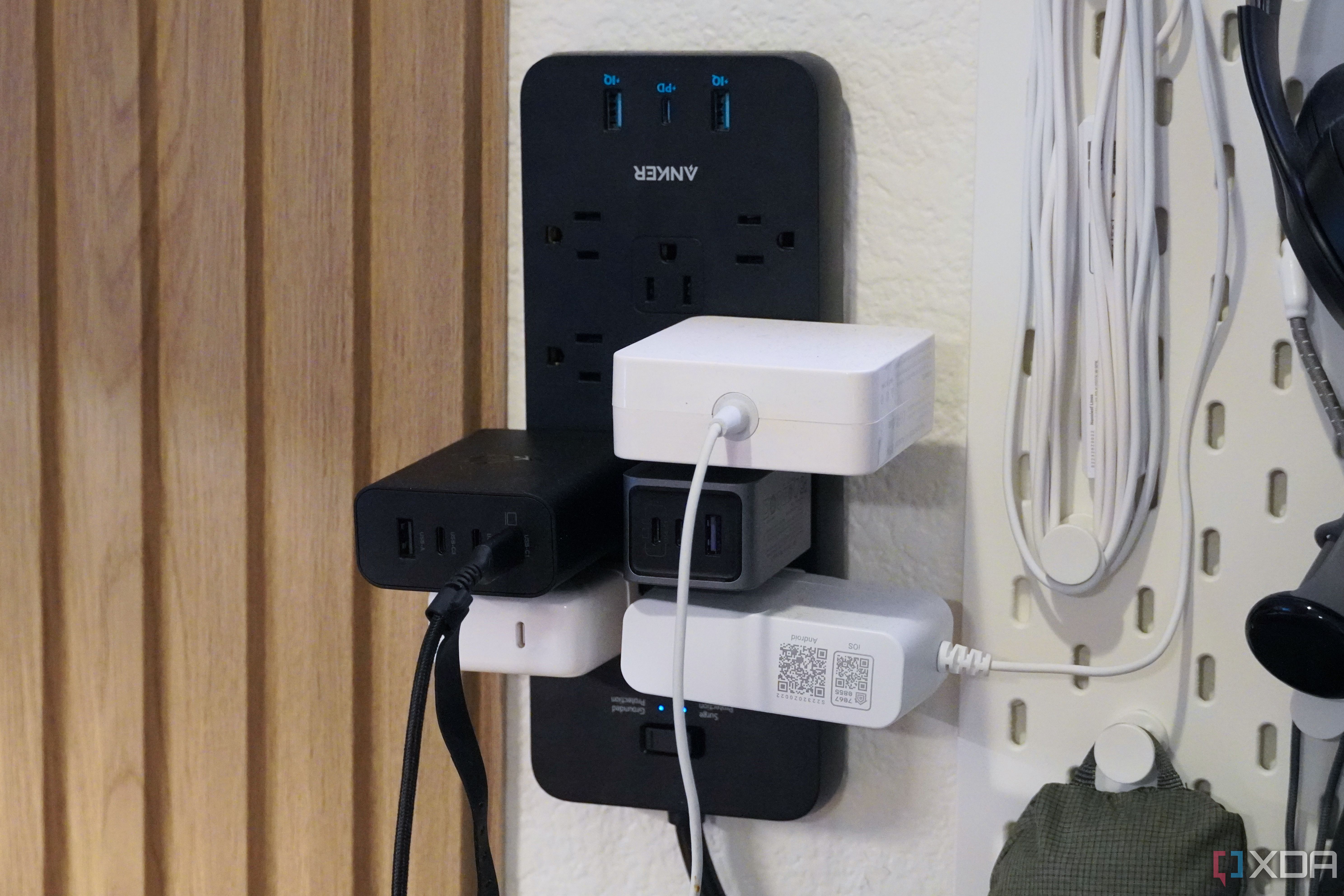 The Anker 12-outlet surge protector with a bunch of stuff plugged in.