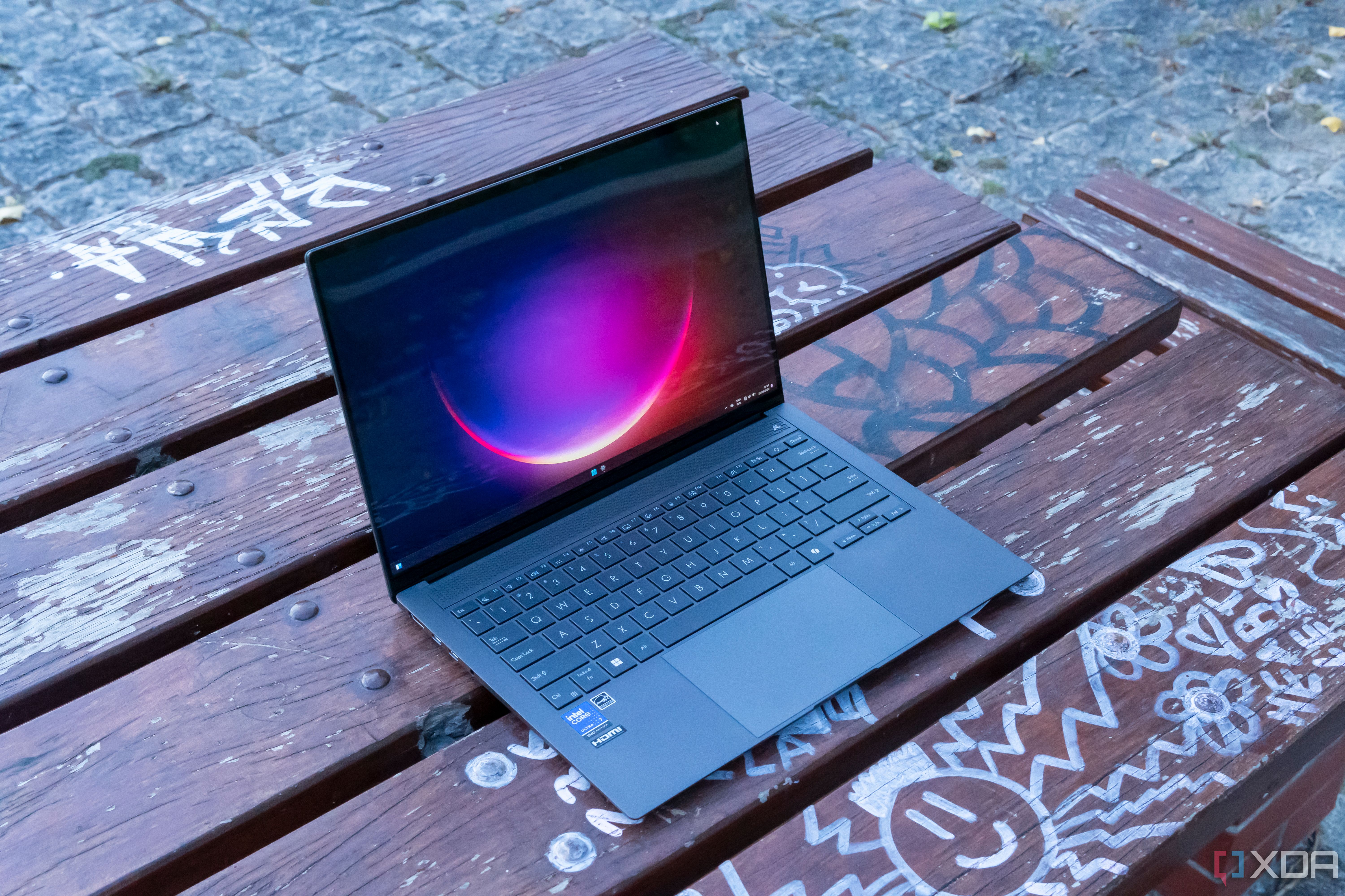 Angled view of the Asus Zenbook S 14 showing the Windows 11 desktop