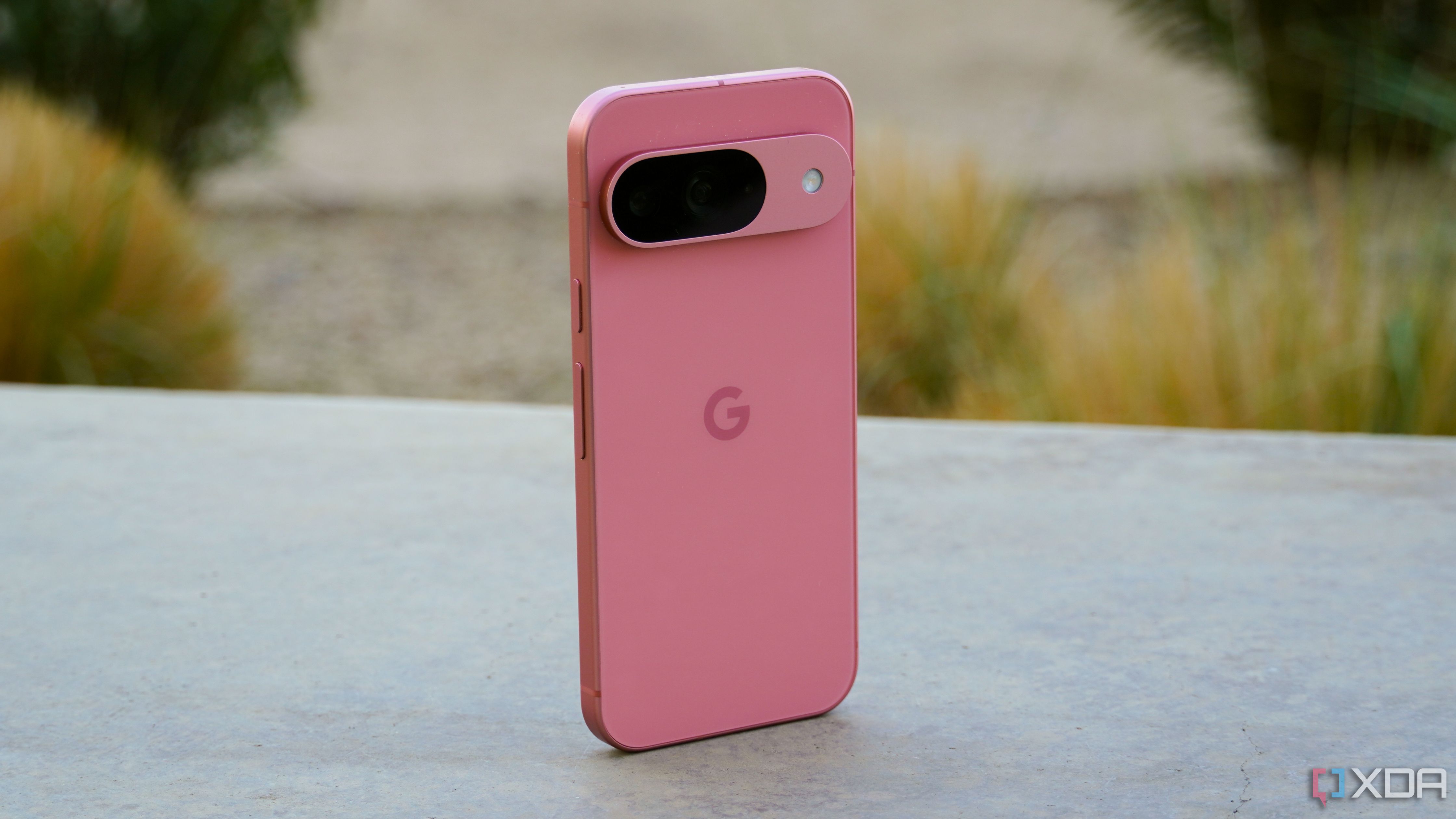 The Google Pixel 9 on a concrete ledge.