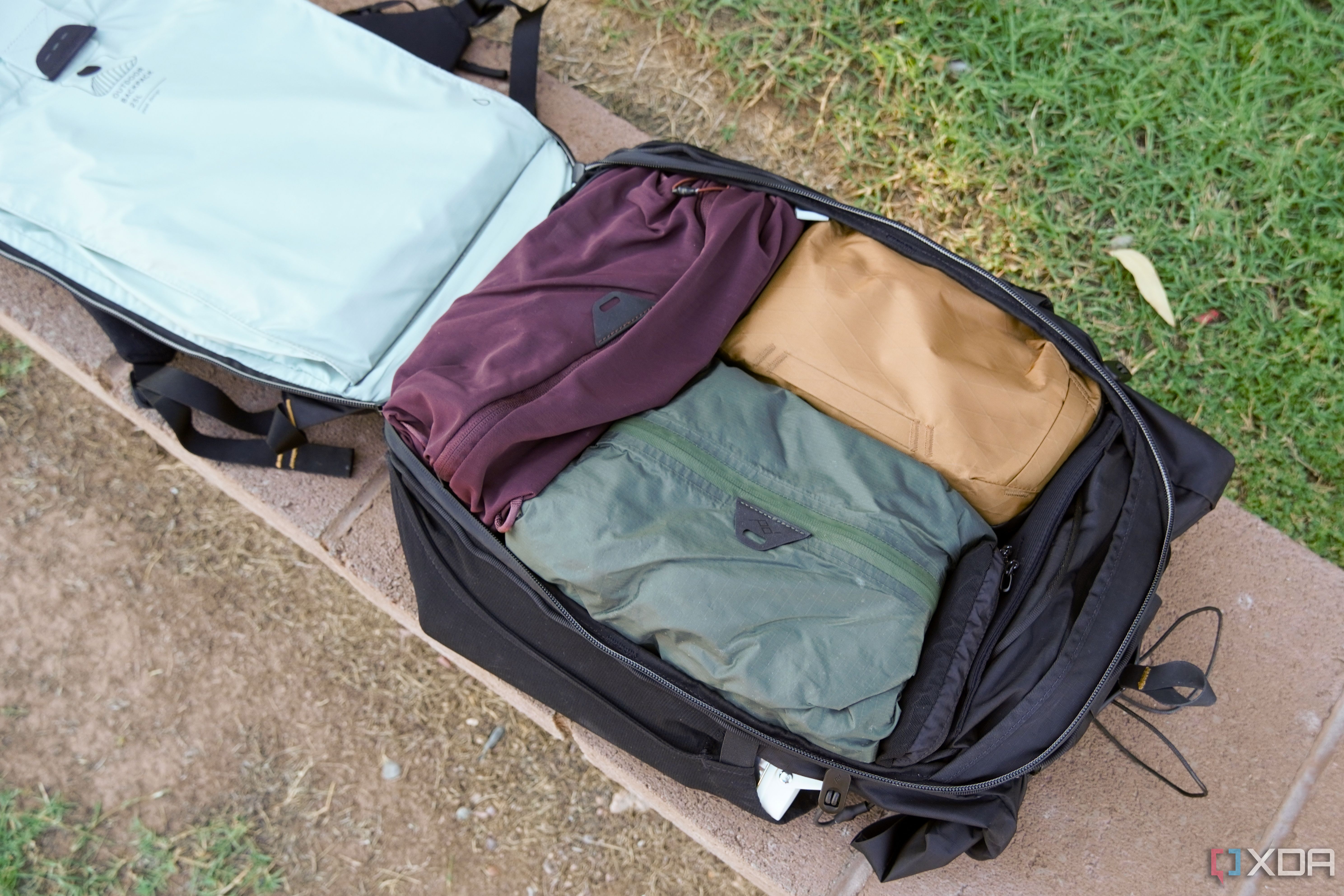 A wide shot of the Peak Design Outdoor Backpack opened.