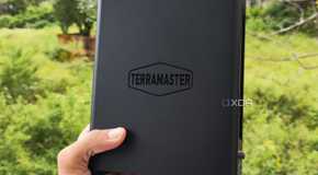 A person holding a TerraMaster F8 SSD Plus NAS