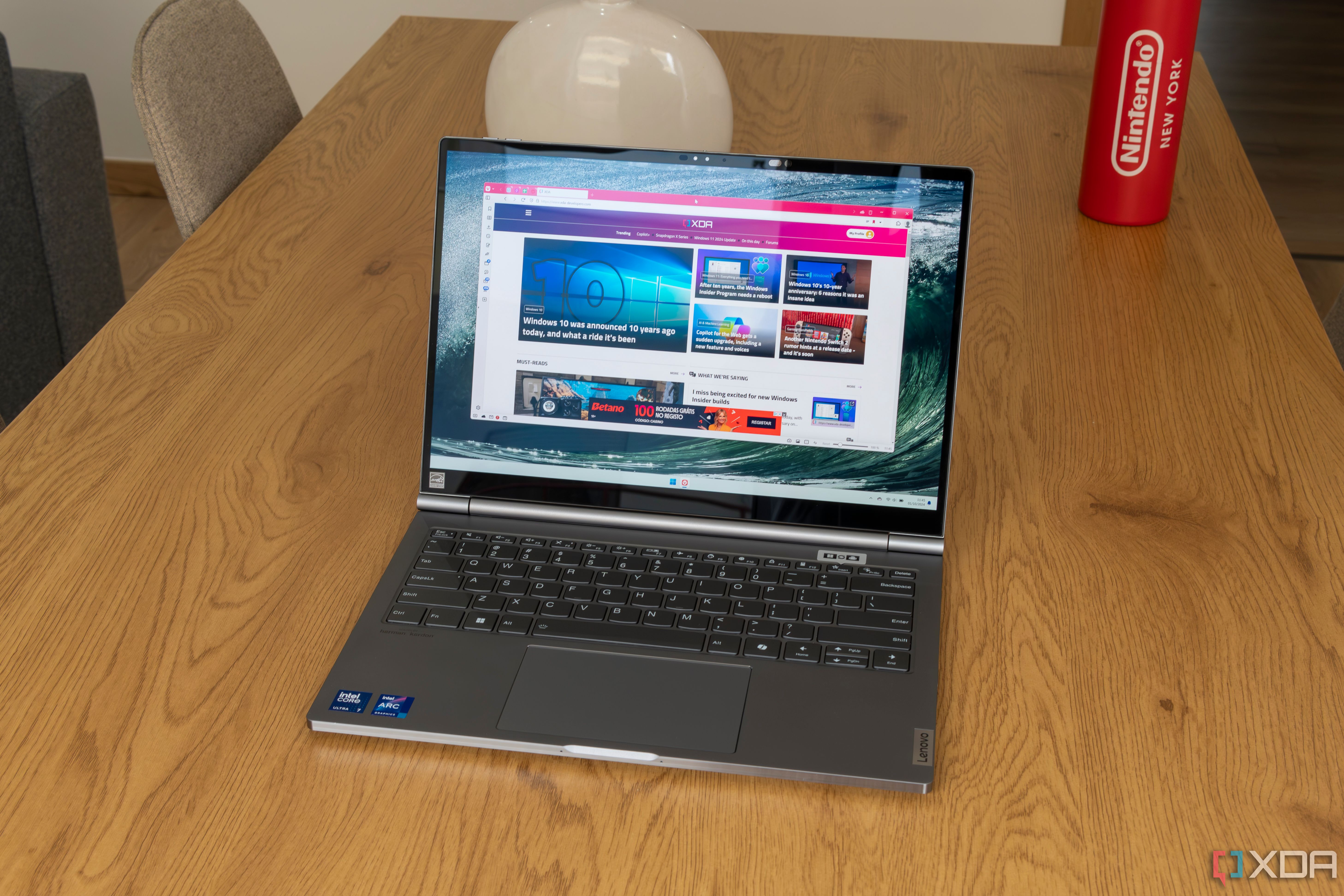 A Lenovo ThinkBook Plus Gen 5 Hybrid showing the XDA homepage on Windows 11