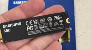 samsung 990 evo plus ssd held in hand back view