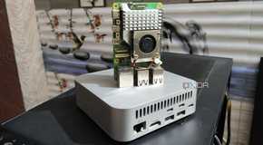 A Raspberry Pi 5 placed on top of an Aiffro K100 NAS