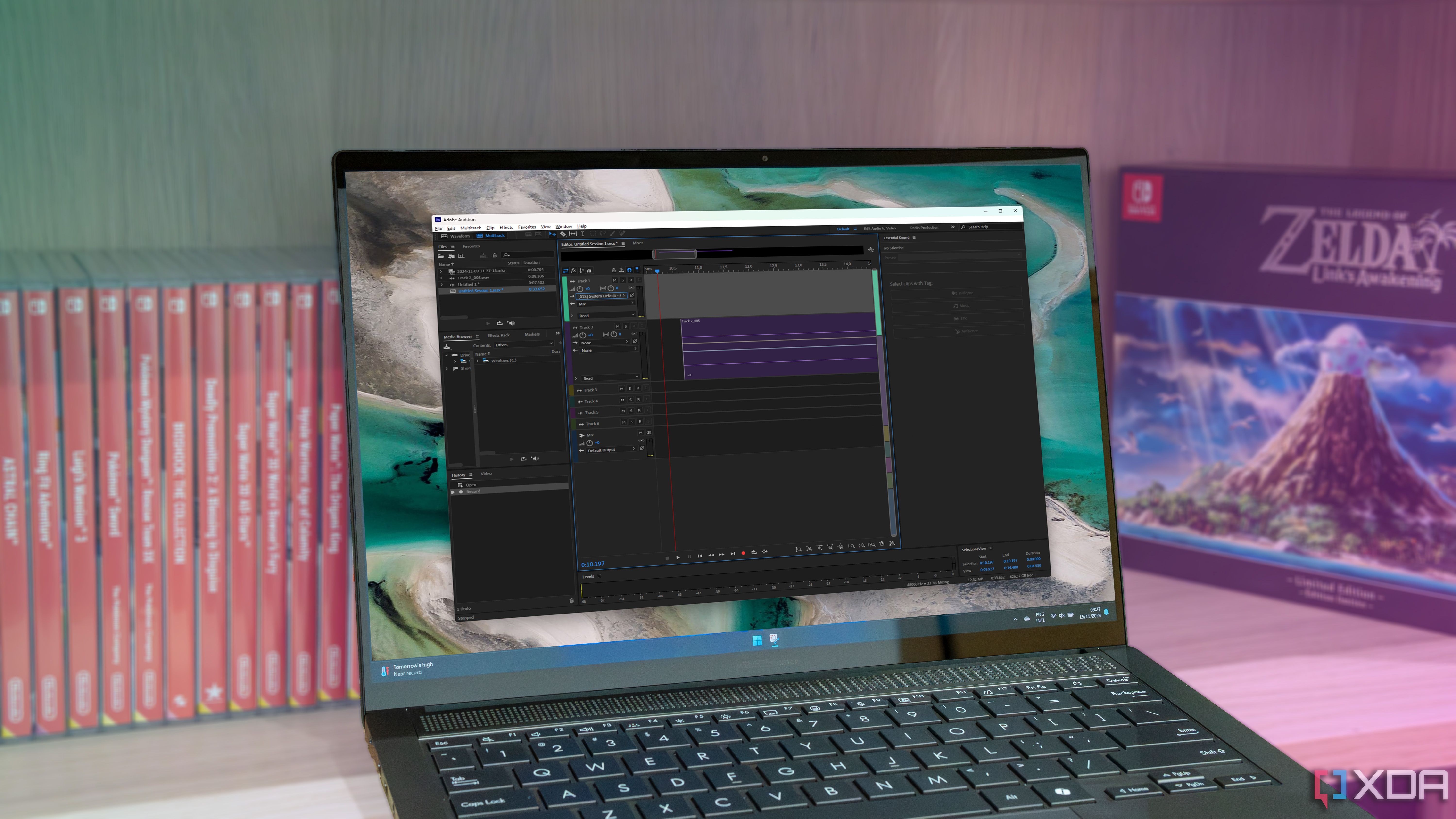 Una computadora portátil con Windows 11 que ejecuta Adobe Audition