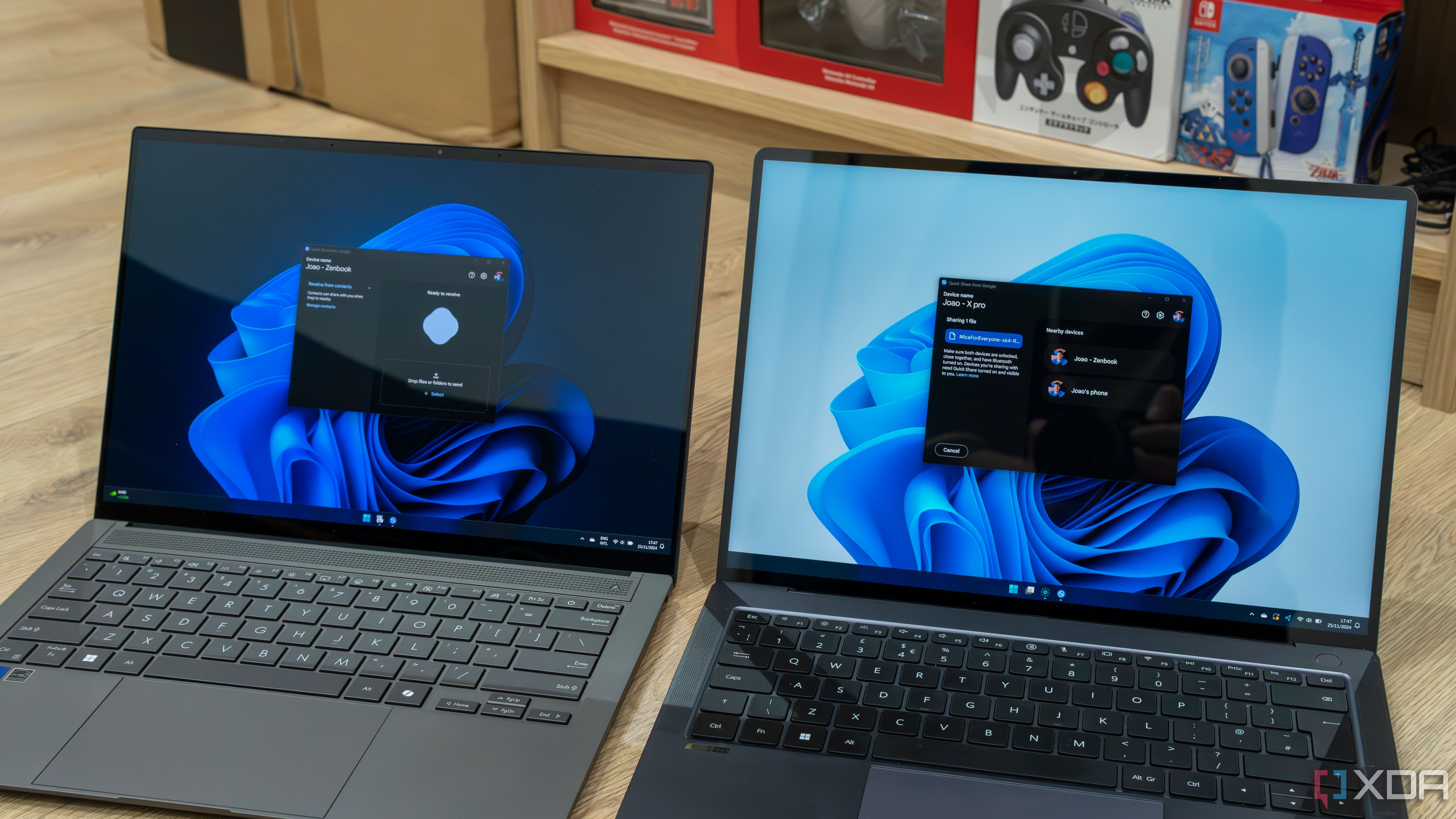 Two Windows 11 laptops side by side using Quick Share from Google