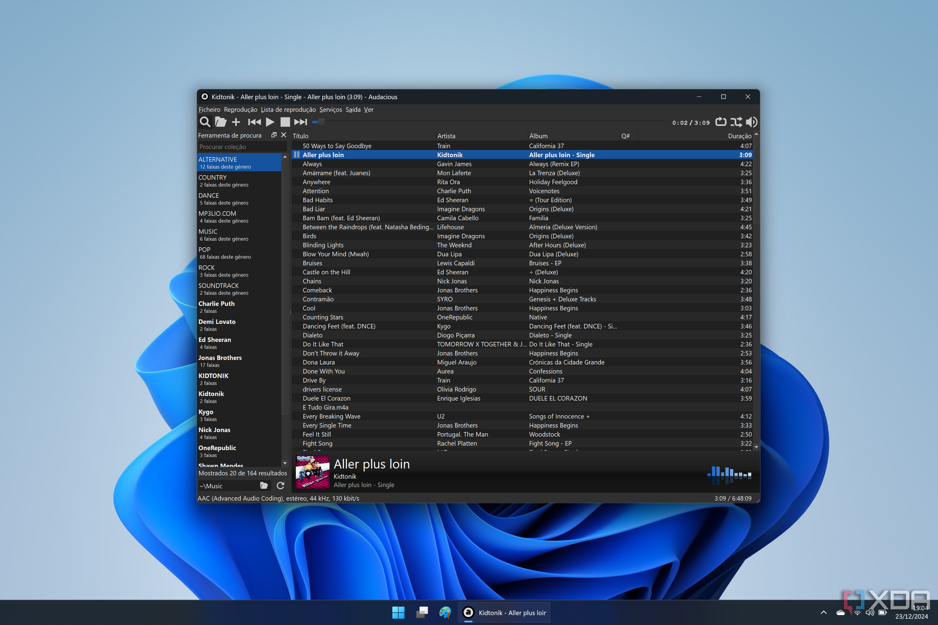 Captura de pantalla de Windows 11 ejecutando Audacious y mostrando una biblioteca de música