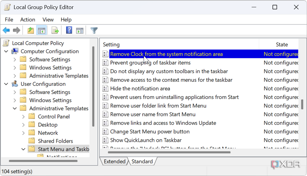 choosing Remove Clock from the system notification area in group policy