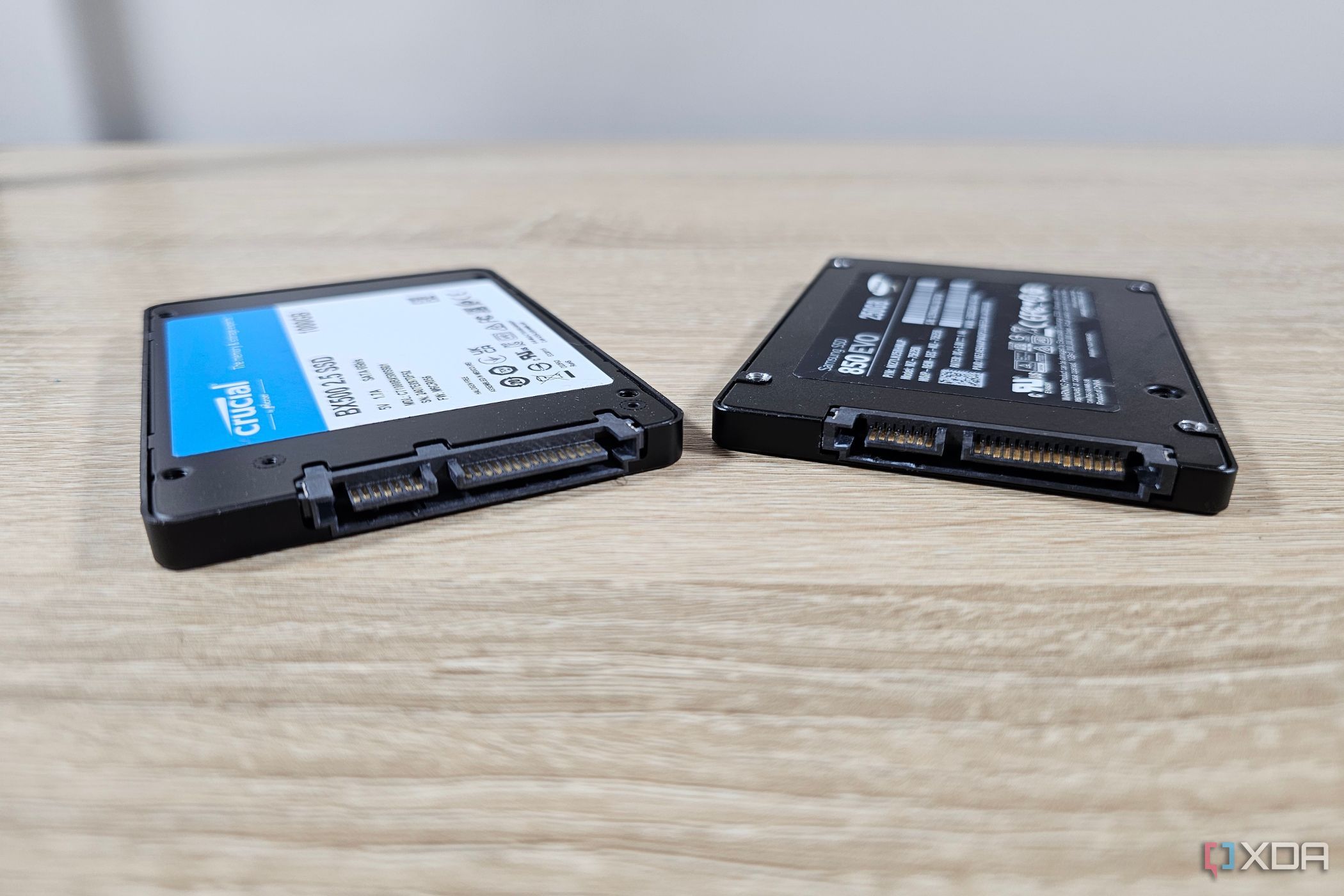 a samsung and crucial ssd next to each other on a table