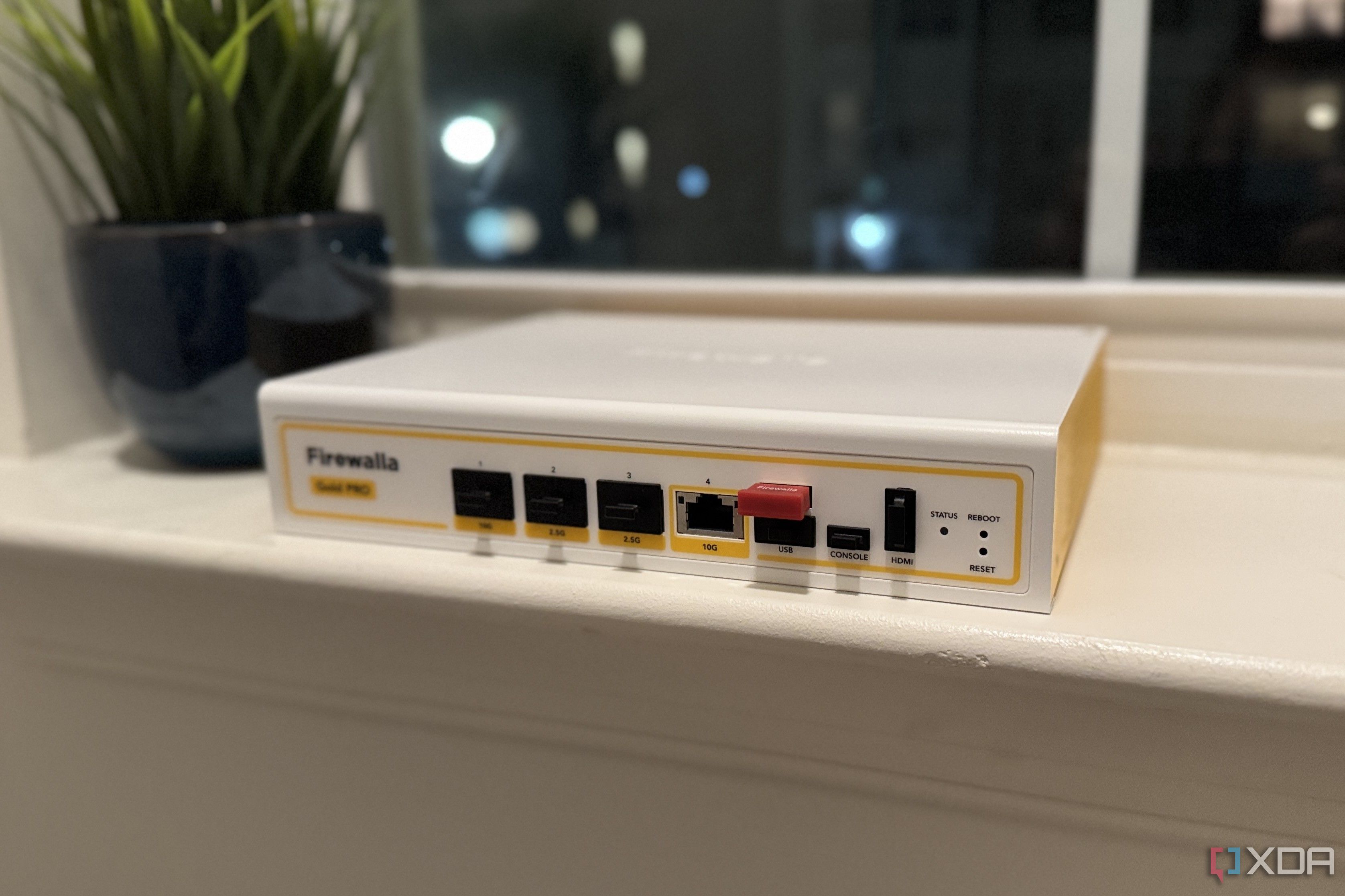firewalla gold pro hardware firewall on a windowsill