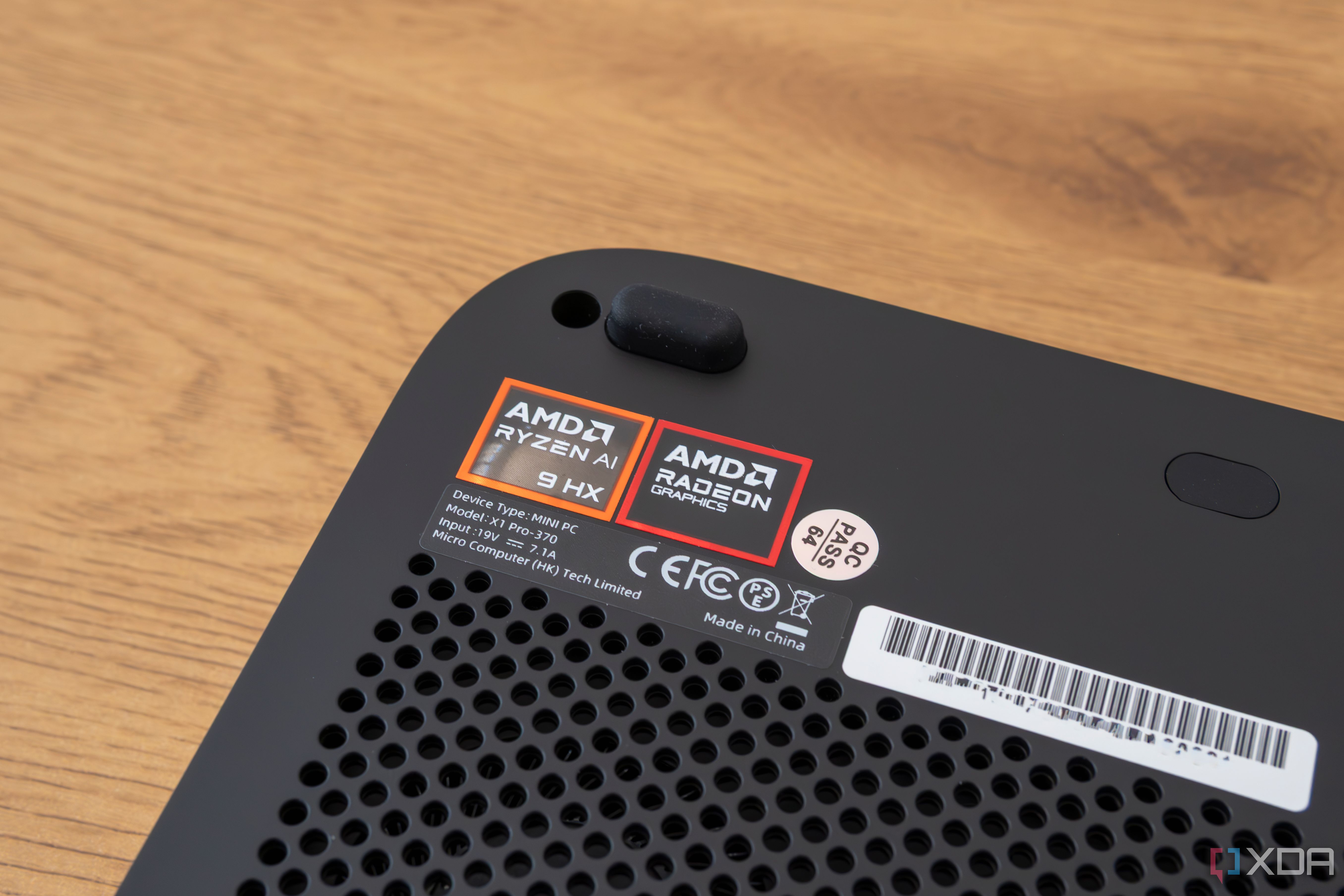 Close-up of the AMD Ryzen and Radeon logos on the Minisforum AI X1 Pro