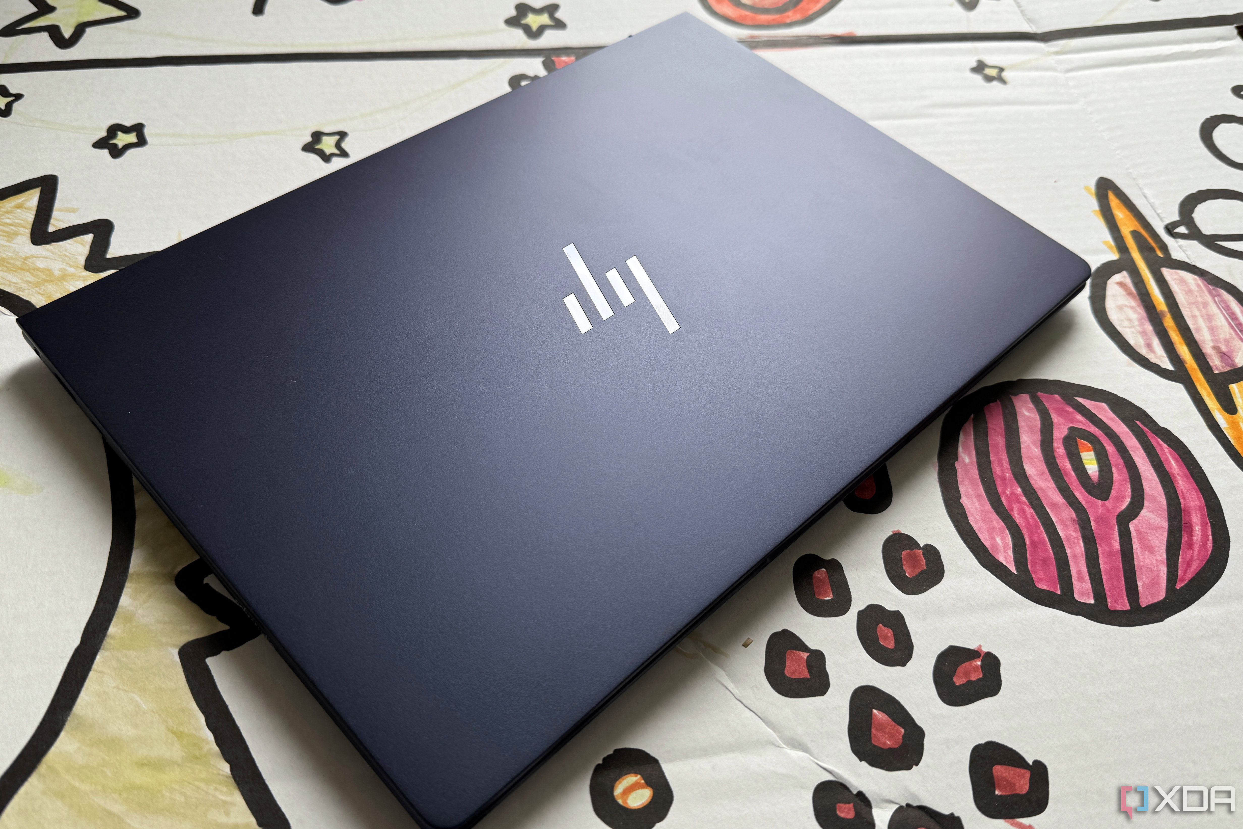 HP EliteBook Ultra G1i AI on a cardboard bus