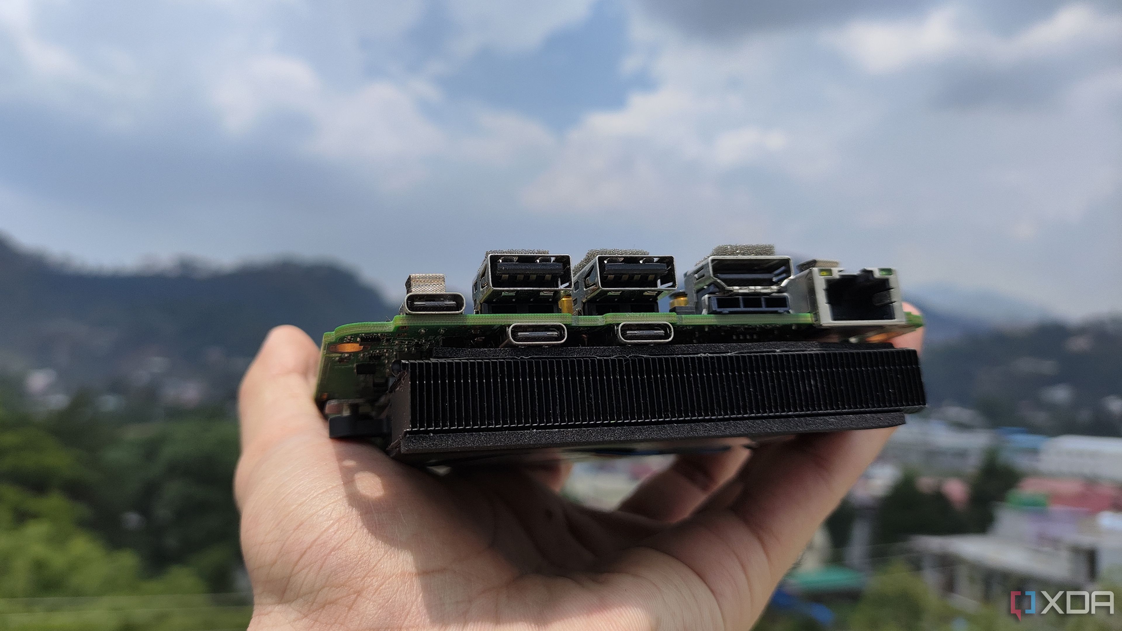 A person holding an Intel N100 mini-PC
