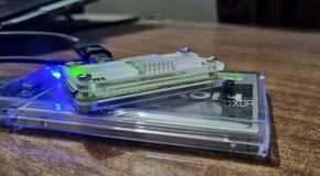 photo of raspberry pi downloading device with sdd on a table