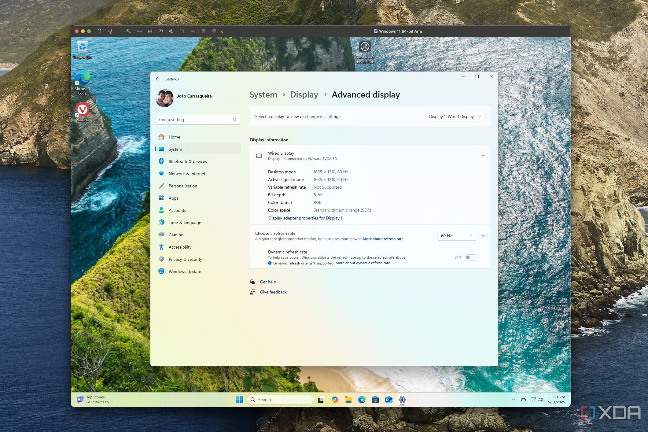 Screenshot of Windows 11 running in VMware Fusion for Mac, showing the Settings app with display settings showing the refresh rate is 60Hz