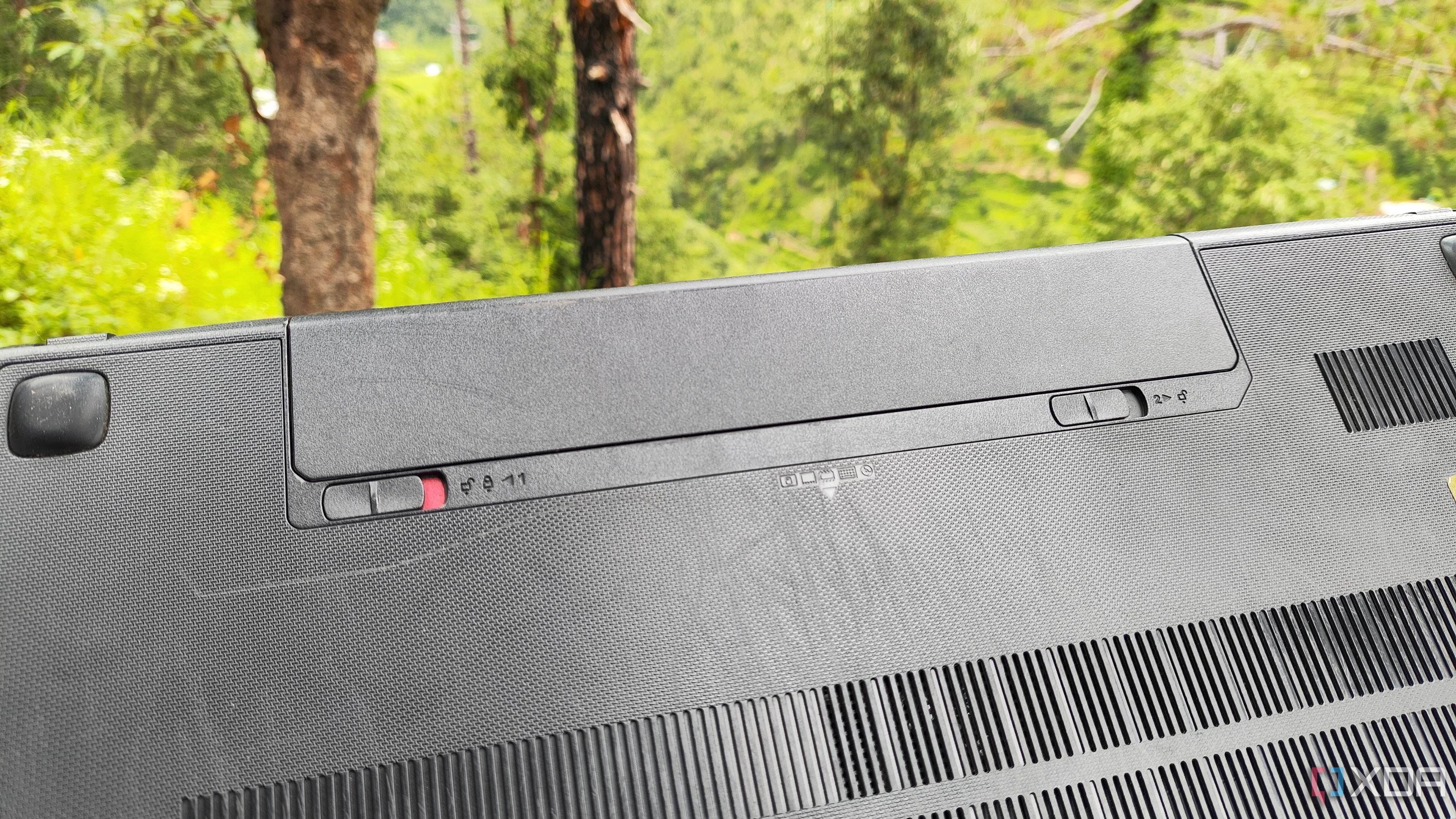 The battery slot on an old laptop