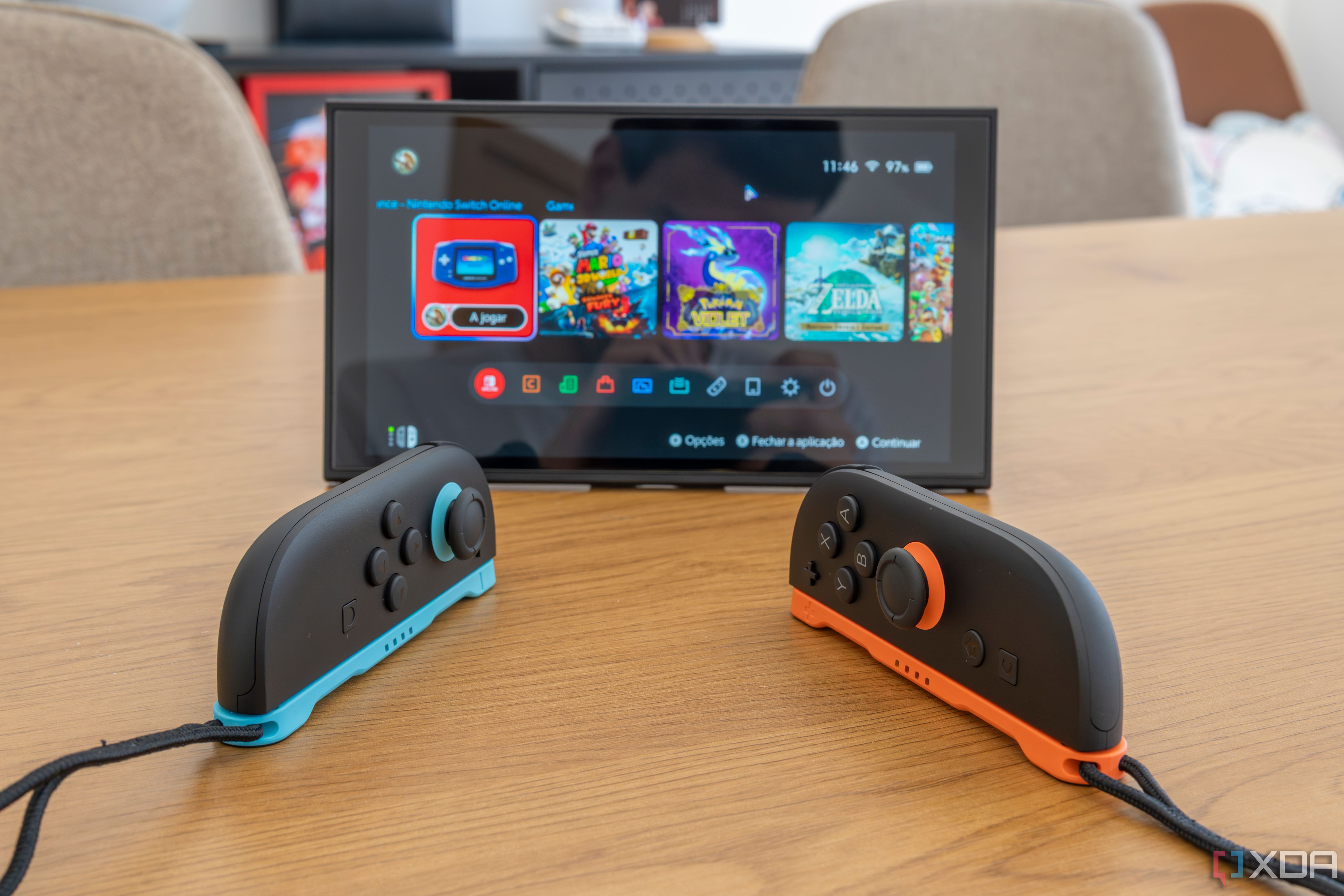 Two Joy-Con 2 controllers in mouse mode in front of a Nintendo Switch 2 in tabletop mode