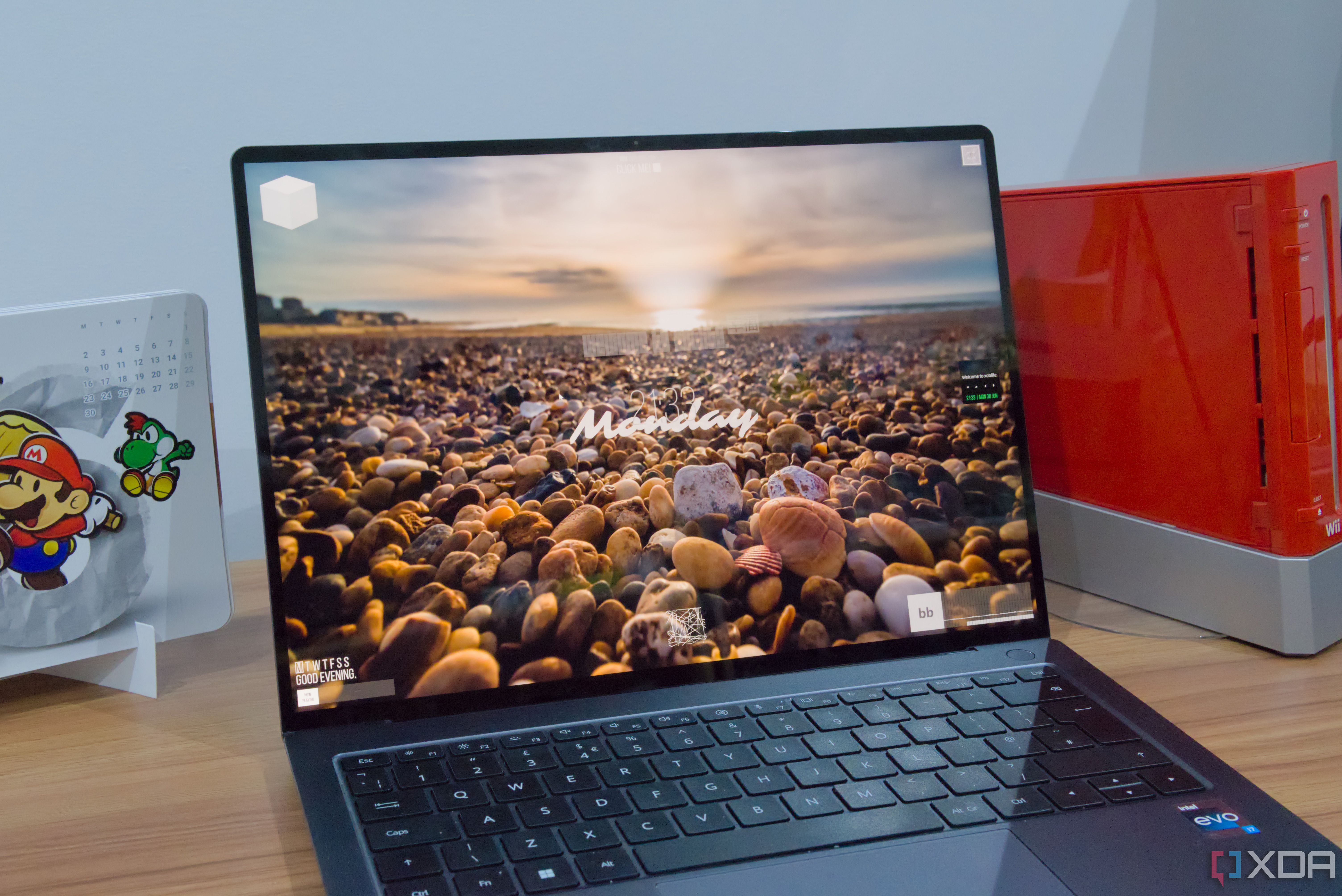 A Windows 11 laptop with xoblite showing multiple widgets on the desktop