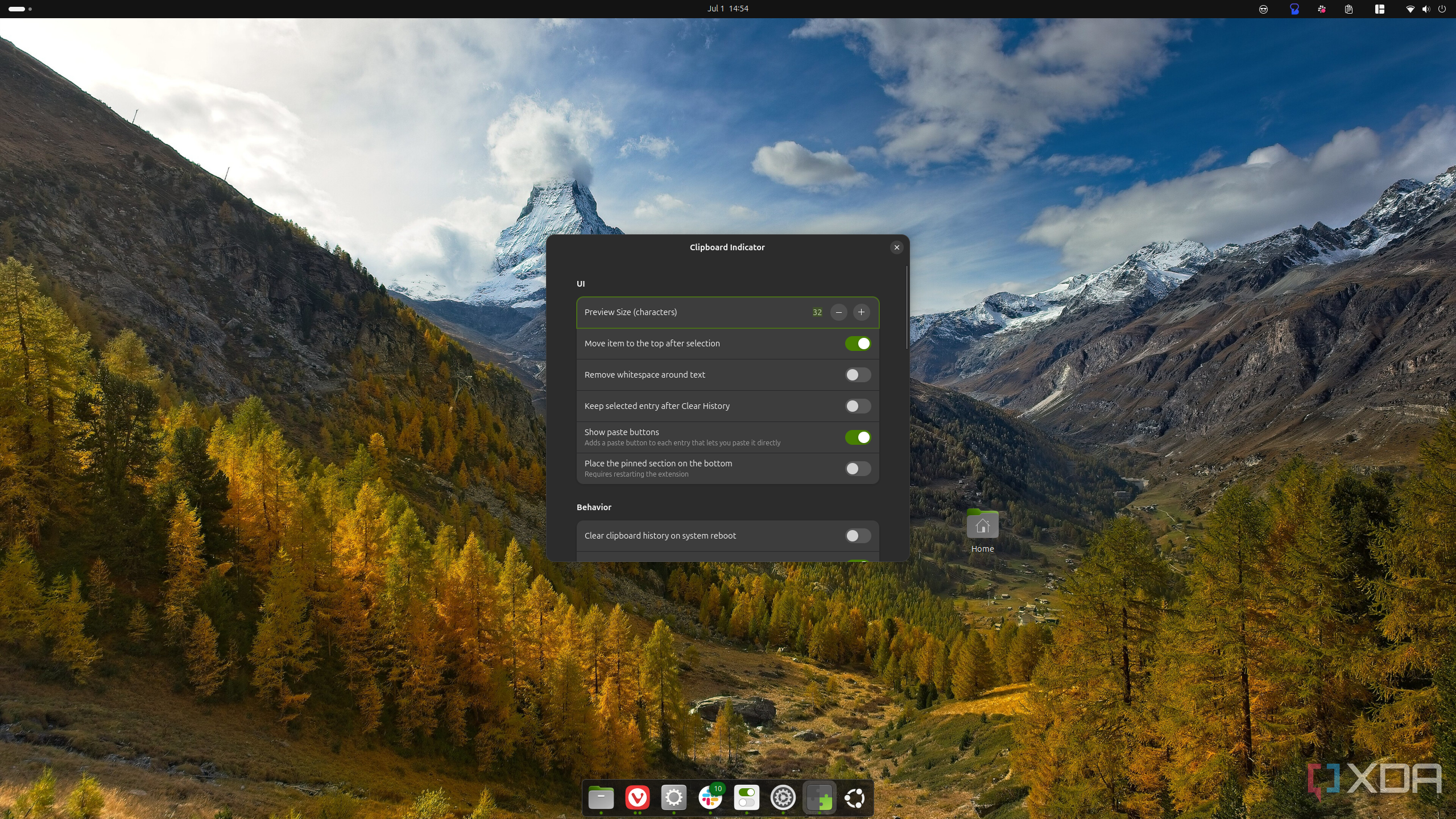 Screenshot of an Ubuntu desktop showing settings for the Clipboard Indicator extension