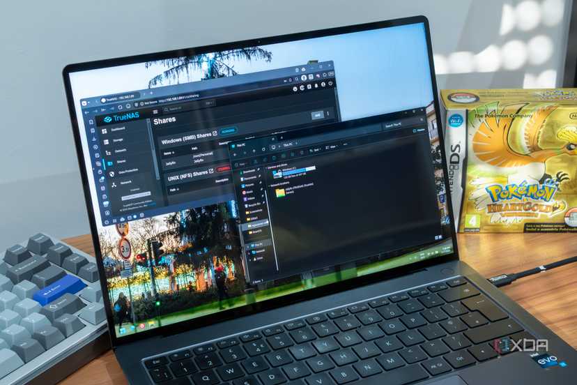 A Windows 11 laptop showing an SMB share in File Explorer with a TrueNAS dashboard open in the background