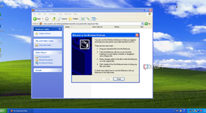 A Windows XP desktop, showing the Welcome to Briefcase setup menu in Windows Explorer, explaining how to use the software.