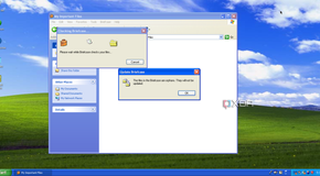 A Briefcase window, shown open in Windows Explorer on Windows XP, warning that files inside the briefcase are now orphaned, with their original files deleted.