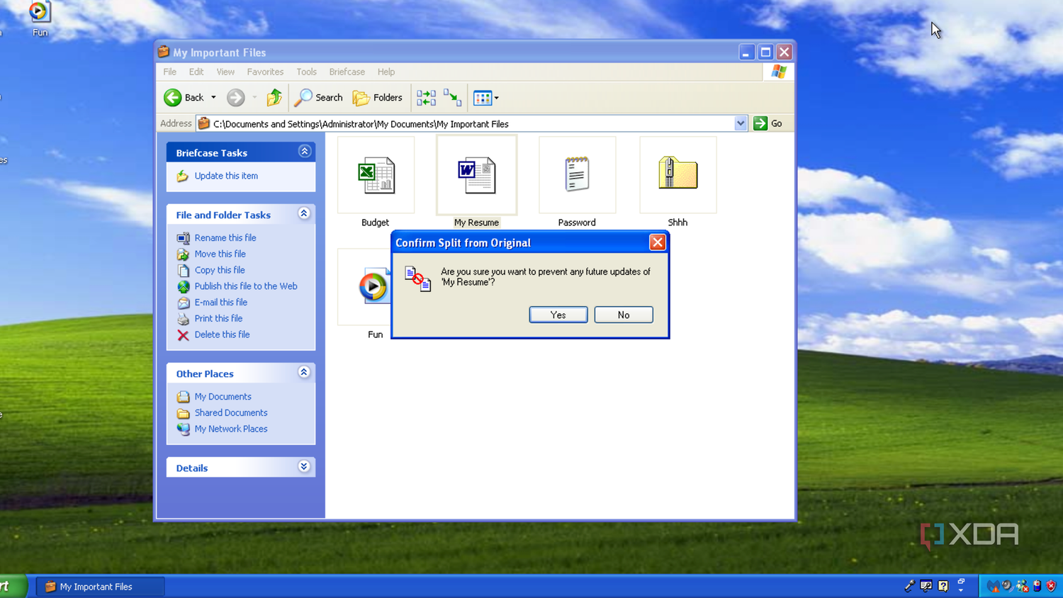 A Briefcase folder, open in Windows Explorer on Windows XP, warning the user about splitting a Briefcase file's link with the original will prevent the original from being updated in the future.